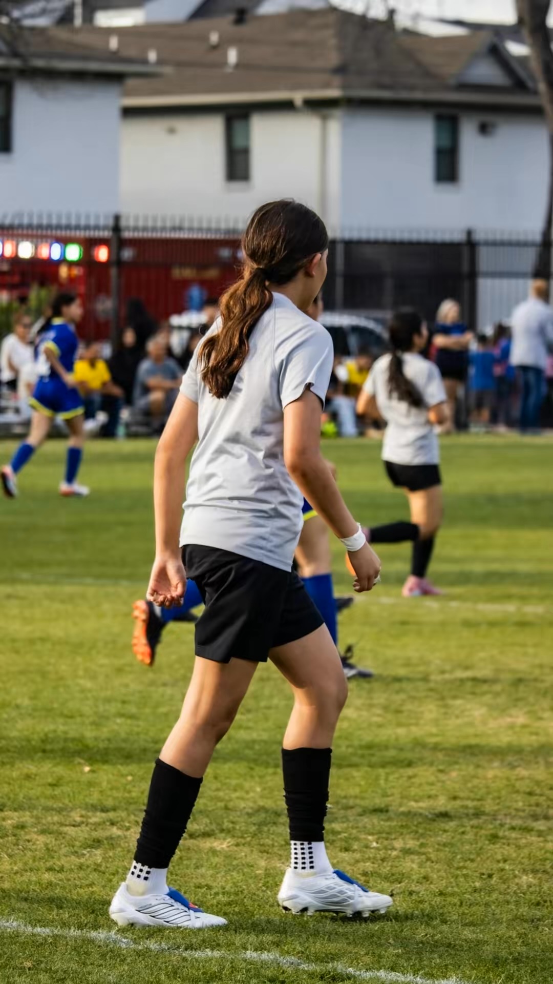 Jaylei tracking play in a white match kit