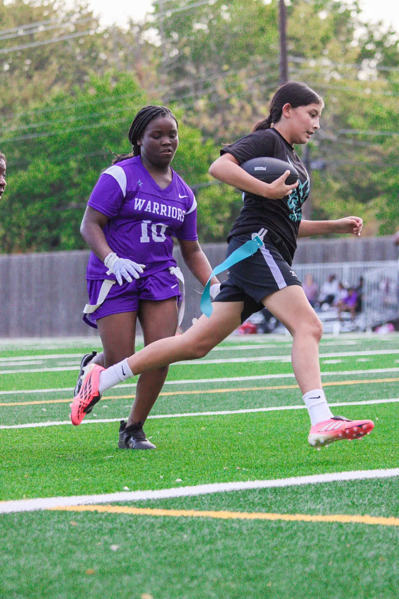 Jaylei carrying the ball in the open field